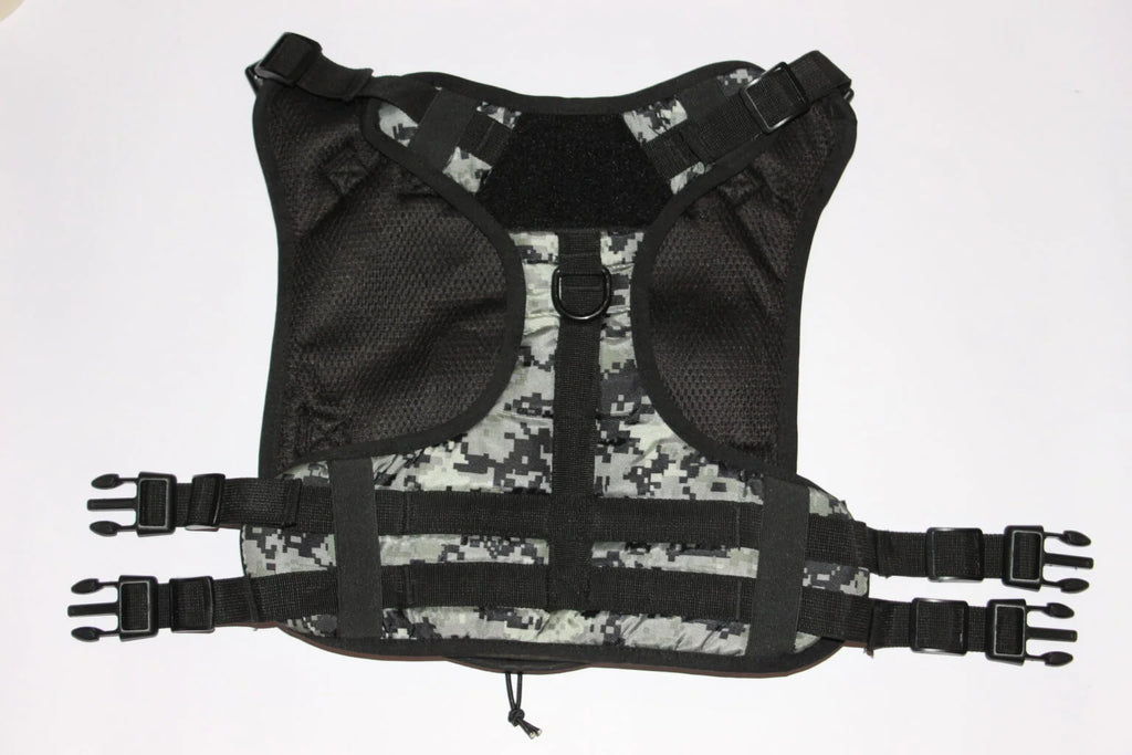 Flat view of a heavy-duty camouflage tactical pet harness with secure quick-release buckles and adjustable straps from The Woof Parade.