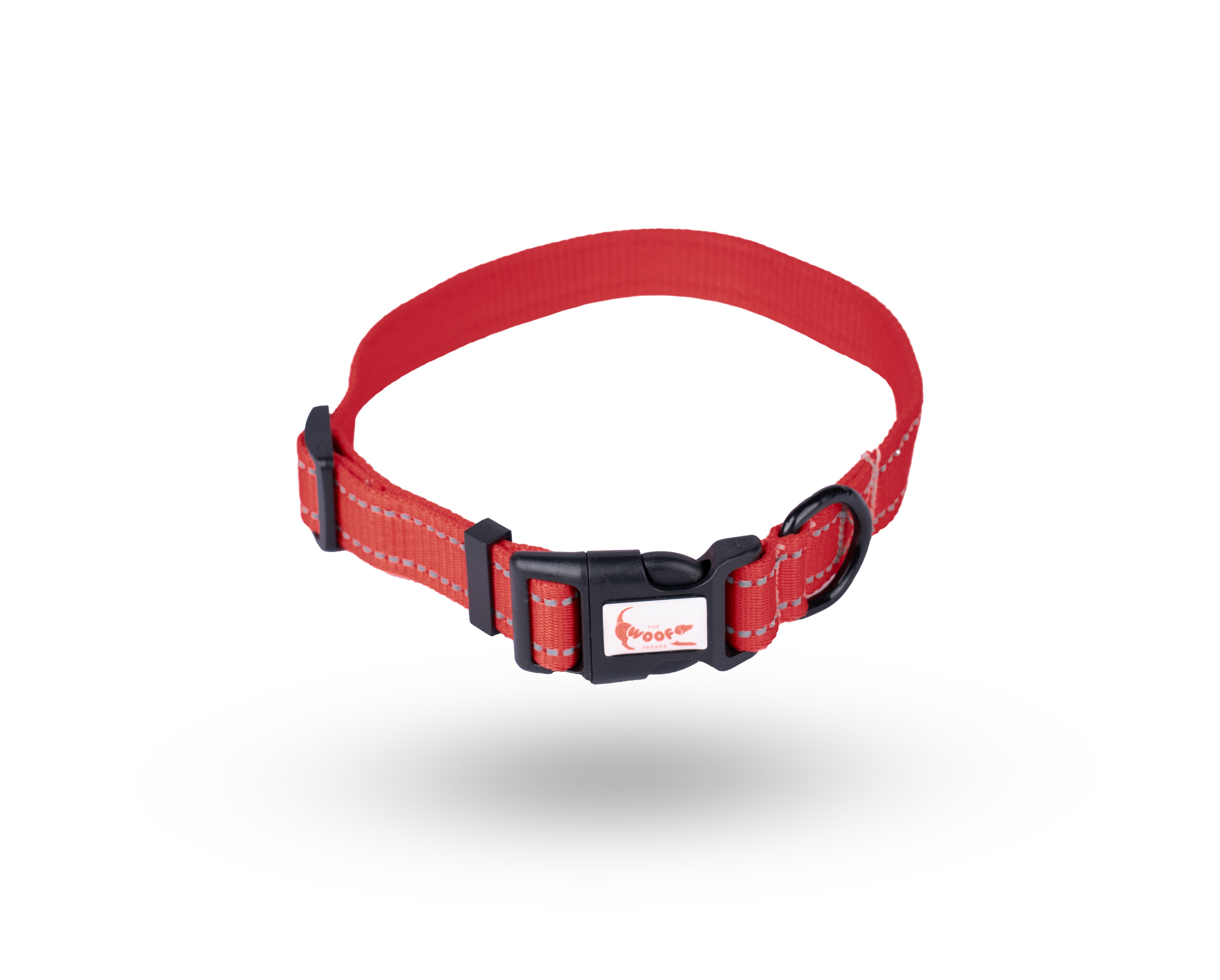 Durable red reflective dog collar with a secure side press buckle and metal D-ring by The Woof Parade.